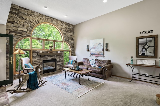 22774 Olivine St NW, Nowthen, MN 55330 - carpeted living area with a fireplace, baseboards, and recessed lighting