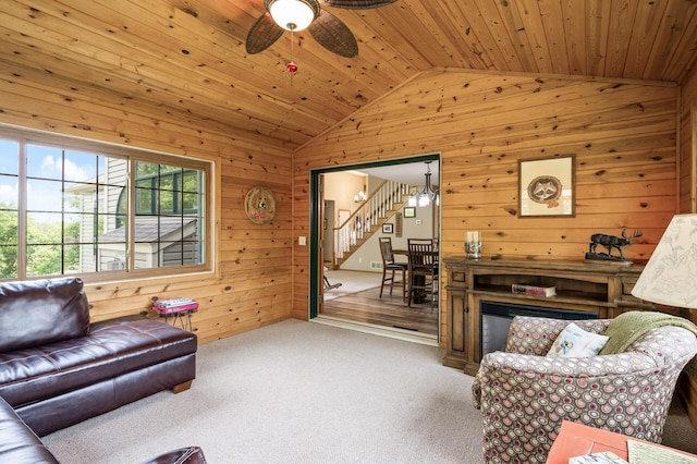 22774 Olivine St NW, Nowthen, MN 55330 - living room with lofted ceiling, wooden walls, stairway, wood ceiling, and carpet flooring