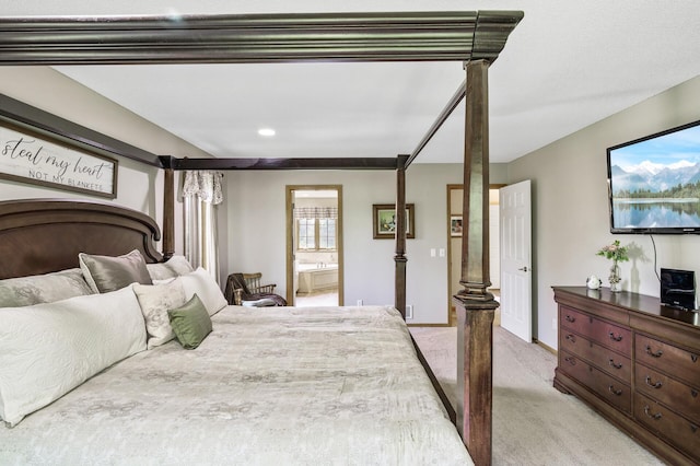 22774 Olivine St NW, Nowthen, MN 55330 - bedroom with light colored carpet, connected bathroom, recessed lighting, baseboards, and ornate columns