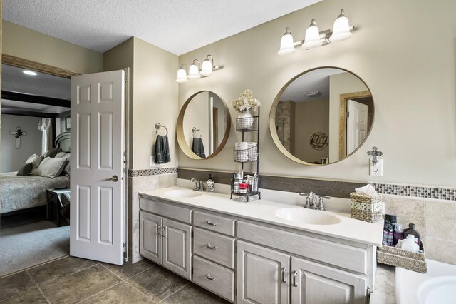 22774 Olivine St NW, Nowthen, MN 55330 - ensuite bathroom featuring double vanity and a tub to relax in