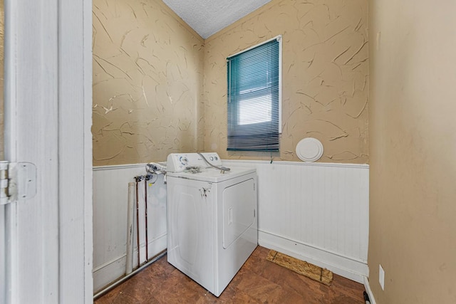 300 Ellington St, West Concord, MN 55985 - laundry room featuring washer / dryer, a wainscoted wall, a textured ceiling, and wood walls