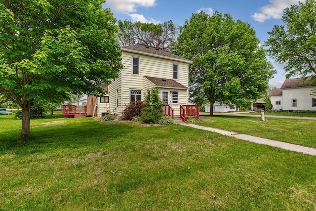 300 Ellington St, West Concord, MN 55985 - view of front facade with a wooden deck and a front yard