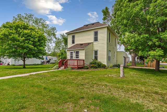 300 Ellington St, West Concord, MN 55985 - view of front of home with a deck, a shingled roof, and a front lawn