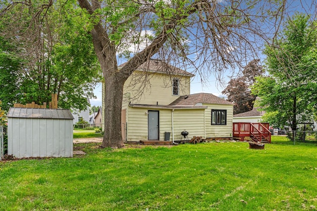 300 Ellington St, West Concord, MN 55985 - rear view of property featuring a deck and a shingled roof