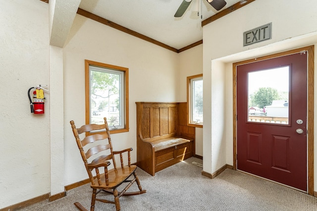 520 State St, West Concord, MN 55985 - entryway featuring light colored carpet, a ceiling fan, baseboards, and ornamental molding
