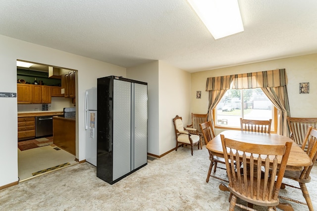 520 State St, West Concord, MN 55985 - dining area featuring a textured ceiling and light colored carpet