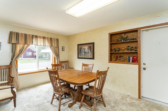 520 State St, West Concord, MN 55985 - dining area featuring light colored carpet