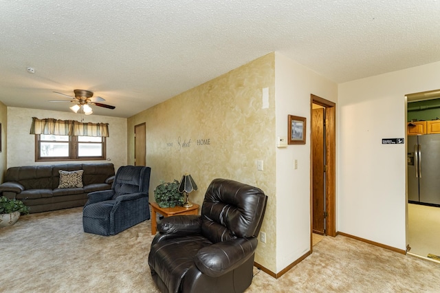 520 State St, West Concord, MN 55985 - living area featuring light carpet, a ceiling fan, a textured ceiling, and baseboards