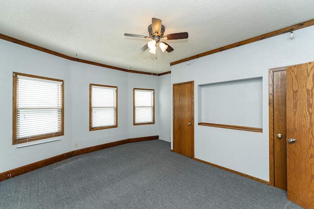 520 State St, West Concord, MN 55985 - unfurnished bedroom featuring a textured ceiling, carpet, baseboards, and a ceiling fan