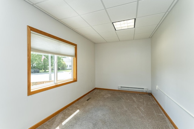 520 State St, West Concord, MN 55985 - unfurnished room featuring baseboard heating, carpet, baseboards, and a drop ceiling