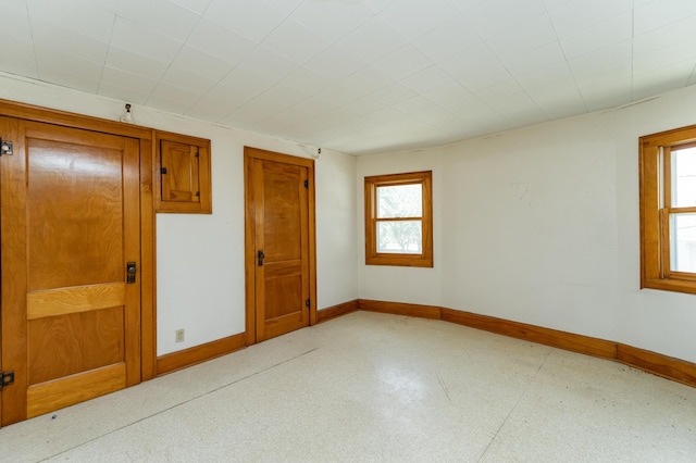 520 State St, West Concord, MN 55985 - unfurnished room with plenty of natural light, baseboards, and light flooring
