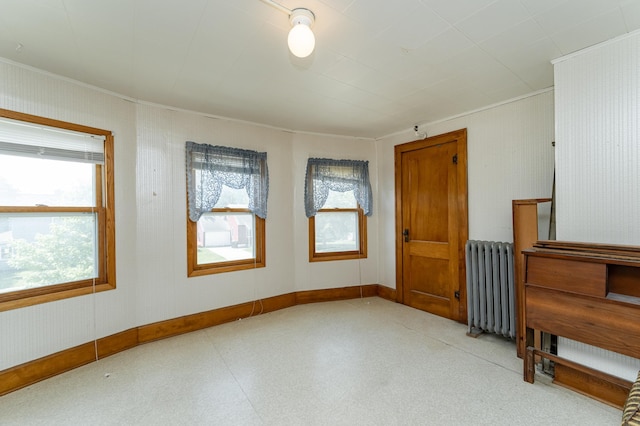 520 State St, West Concord, MN 55985 - unfurnished room featuring radiator heating unit, crown molding, and baseboards