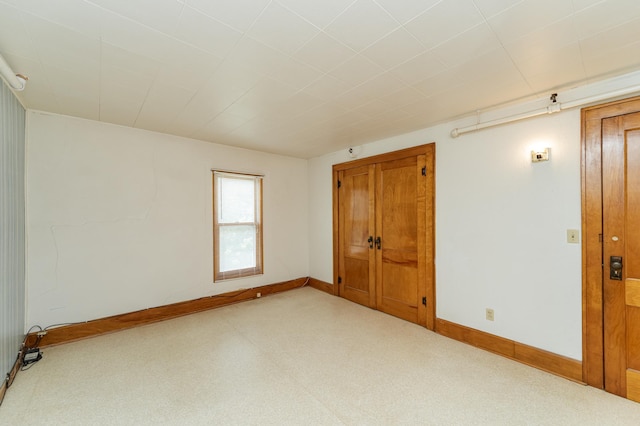 520 State St, West Concord, MN 55985 - empty room with baseboards and light colored carpet