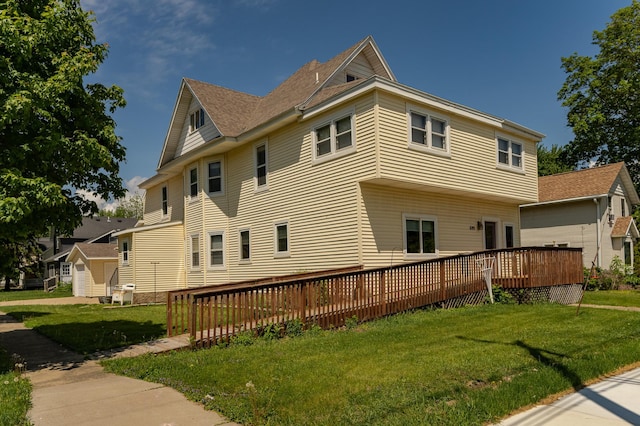 520 State St, West Concord, MN 55985 - view of home's exterior with a wooden deck and a lawn