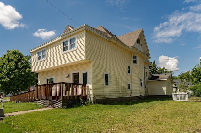 520 State St, West Concord, MN 55985 - back of house with a wooden deck and a yard