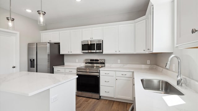 7472 170th Ave NW, Ramsey, MN 55303 - kitchen featuring stainless steel appliances, a sink, white cabinets, pendant lighting, and recessed lighting