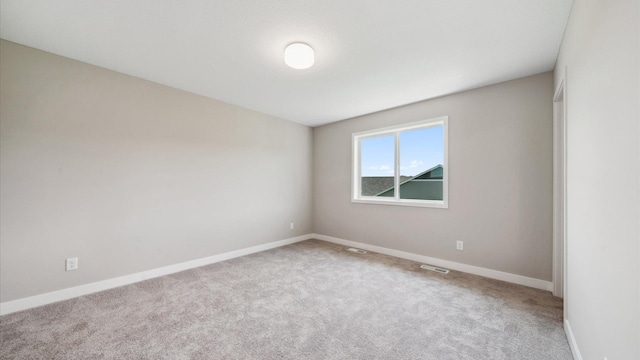 7472 170th Ave NW, Ramsey, MN 55303 - carpeted spare room featuring baseboards