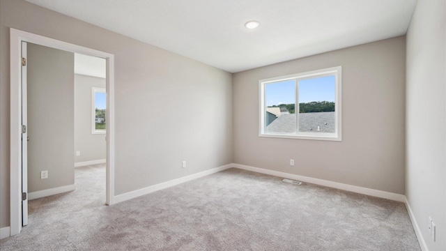 7472 170th Ave NW, Ramsey, MN 55303 - empty room with carpet floors and baseboards