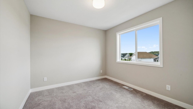 7472 170th Ave NW, Ramsey, MN 55303 - spare room with carpet and baseboards