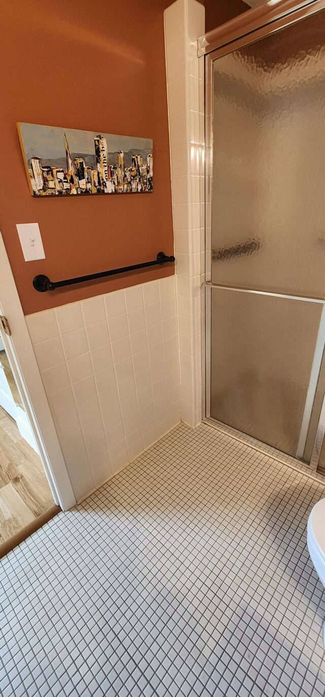 6615 Lake Shore Dr S Unit 717, Richfield, MN 55423 - bathroom featuring a shower stall and tile patterned floors