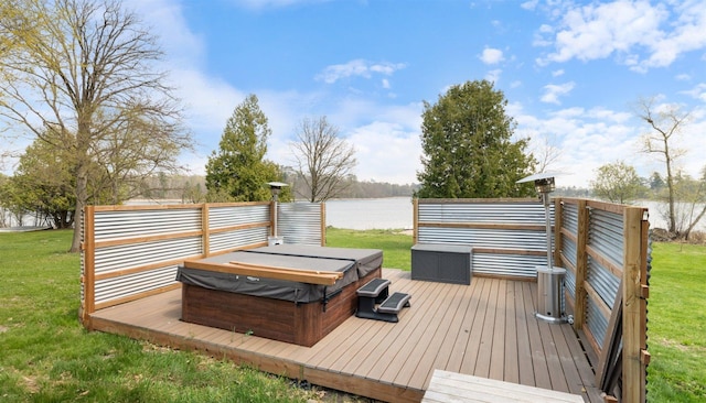 604 16th Ave, Grand Rapids, MN 55744 - wooden deck with a covered hot tub, a water view, and a lawn
