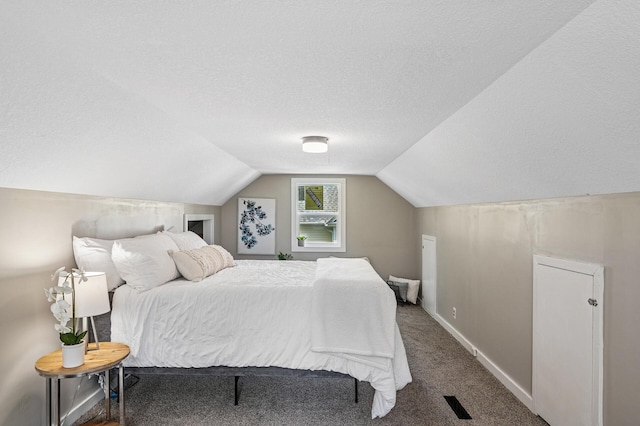 404 8th Ave S, Princeton, MN 55371 - carpeted bedroom with a textured ceiling, vaulted ceiling, and baseboards