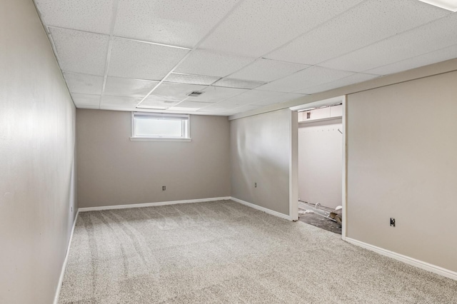 404 8th Ave S, Princeton, MN 55371 - basement with carpet flooring, a paneled ceiling, and baseboards