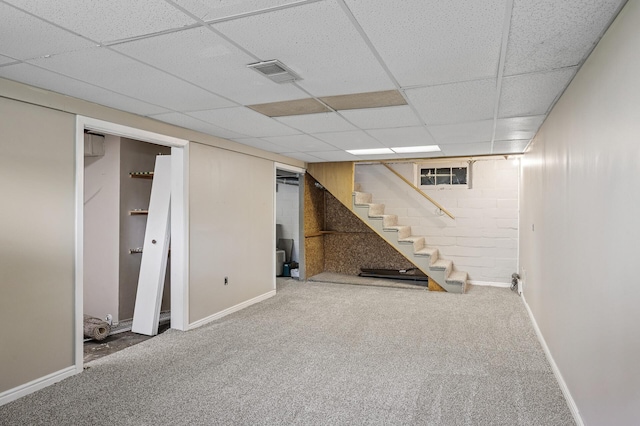 404 8th Ave S, Princeton, MN 55371 - finished below grade area featuring stairway, carpet flooring, baseboards, and a paneled ceiling