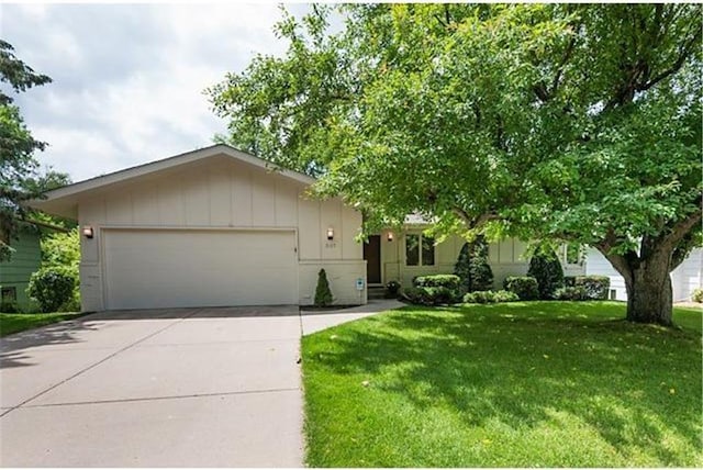 5157 Abercrombie Dr, Edina, MN 55439 - view of front of home with a garage, driveway, and a front yard