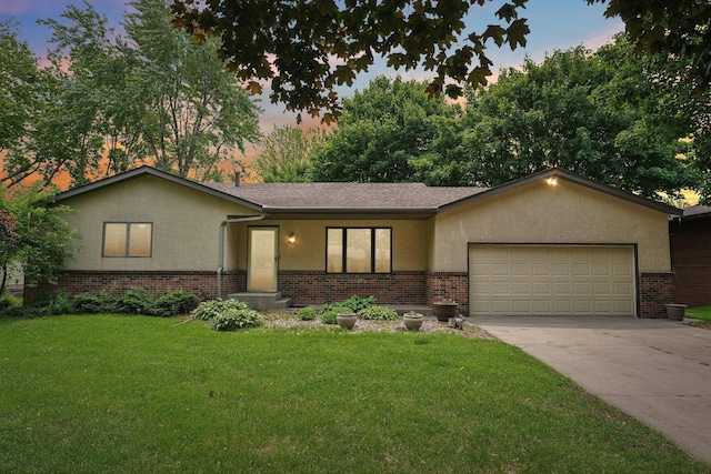 1852 13th Ave W, Shakopee, MN 55379 - view of front of home featuring brick siding, stucco siding, and a garage