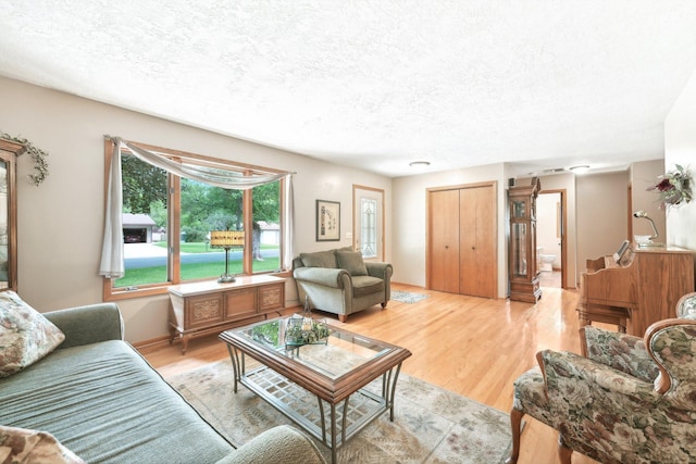 1852 13th Ave W, Shakopee, MN 55379 - living area with a textured ceiling and light wood-type flooring