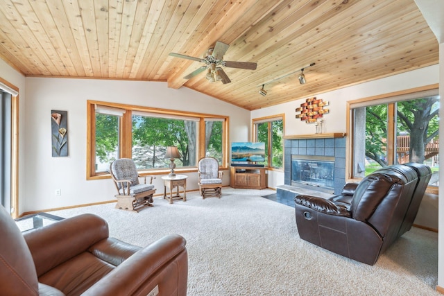 1852 13th Ave W, Shakopee, MN 55379 - living room with carpet floors, wooden ceiling, plenty of natural light, a tile fireplace, and baseboards