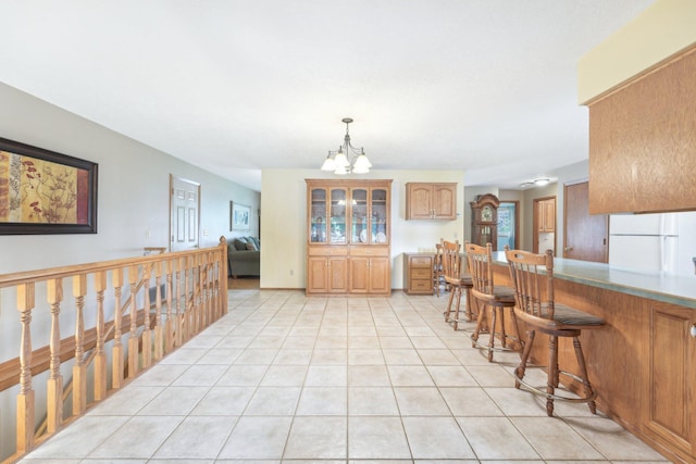 1852 13th Ave W, Shakopee, MN 55379 - dining space with a chandelier and light tile patterned floors