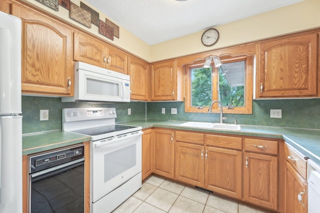 1852 13th Ave W, Shakopee, MN 55379 - kitchen with white appliances, a sink, decorative backsplash, and light tile patterned floors