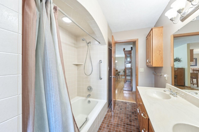 1852 13th Ave W, Shakopee, MN 55379 - bathroom featuring shower / bath combo with shower curtain, double vanity, and tile patterned floors