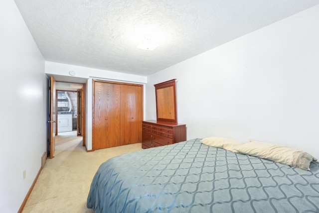 1852 13th Ave W, Shakopee, MN 55379 - bedroom with light carpet, a closet, a textured ceiling, and baseboards