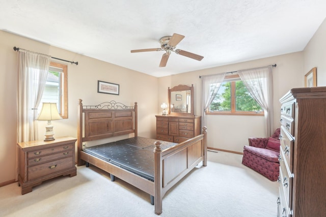 1852 13th Ave W, Shakopee, MN 55379 - bedroom with light carpet, baseboards, and a ceiling fan