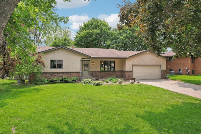1852 13th Ave W, Shakopee, MN 55379 - ranch-style house featuring stucco siding, an attached garage, brick siding, and concrete driveway