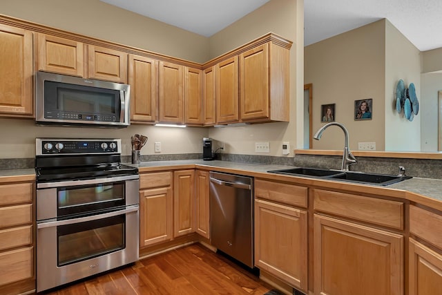 25845 12th St W, Zimmerman, MN 55398 - kitchen with stainless steel appliances, a sink, and dark wood-type flooring