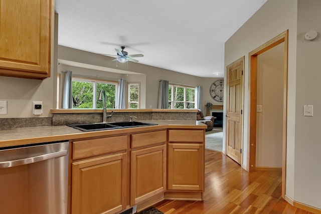25845 12th St W, Zimmerman, MN 55398 - kitchen with dishwasher, a sink, light wood-style flooring, a peninsula, and a ceiling fan