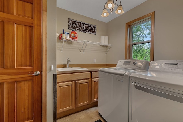 25845 12th St W, Zimmerman, MN 55398 - laundry room featuring washer and dryer, cabinet space, and a chandelier