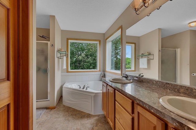 25845 12th St W, Zimmerman, MN 55398 - bathroom with a stall shower, a garden tub, double vanity, and a textured ceiling
