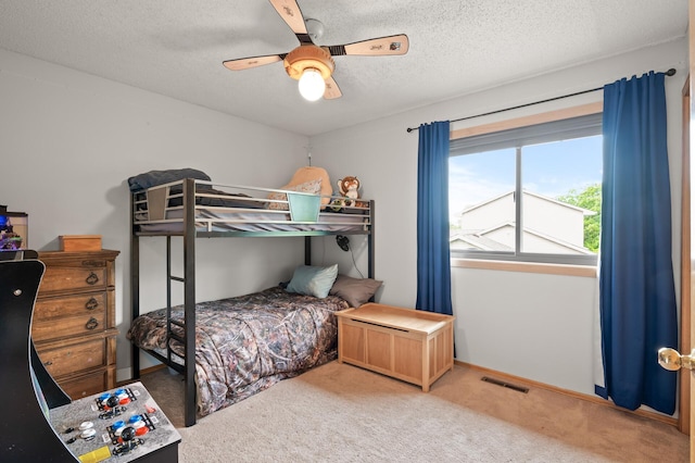 5641 146th Ave NW, Ramsey, MN 55303 - carpeted bedroom with a textured ceiling, a ceiling fan, and baseboards