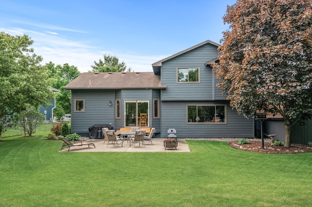 5641 146th Ave NW, Ramsey, MN 55303 - back of house with a patio and a shingled roof