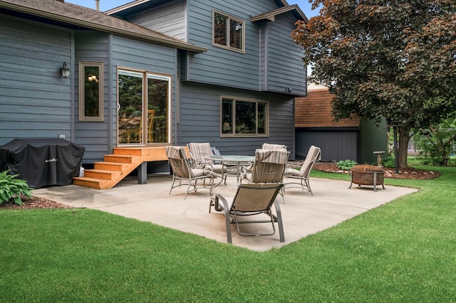 5641 146th Ave NW, Ramsey, MN 55303 - rear view of property featuring a fire pit, a lawn, and a patio area