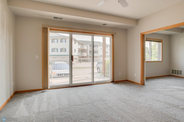3401 28th St SW # 108, Fargo, ND 58104 - spare room with carpet flooring, baseboards, and ceiling fan