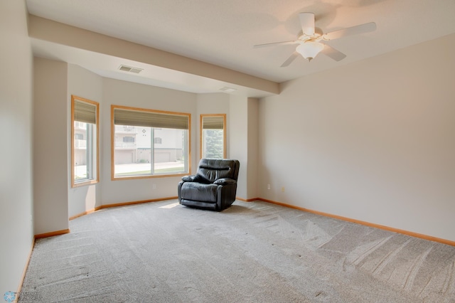 3401 28th St SW # 108, Fargo, ND 58104 - unfurnished room featuring light colored carpet, baseboards, and ceiling fan