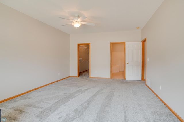 3401 28th St SW # 108, Fargo, ND 58104 - unfurnished bedroom with light colored carpet, a spacious closet, baseboards, and a closet