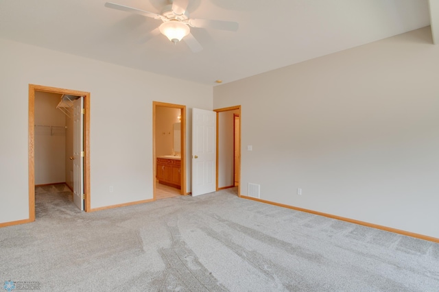 3401 28th St SW # 108, Fargo, ND 58104 - unfurnished bedroom with a spacious closet, light colored carpet, baseboards, and a closet