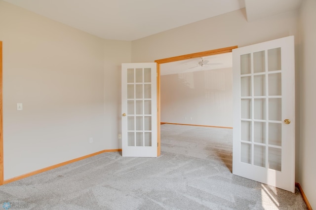 3401 28th St SW # 108, Fargo, ND 58104 - carpeted spare room with french doors, baseboards, and ceiling fan